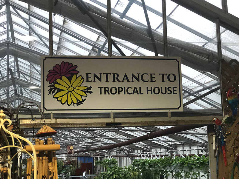 Entrance to tropical house signage