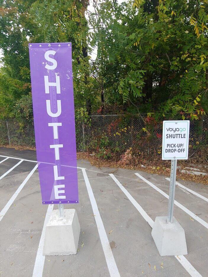 Shuttle custom signage on a parking lot