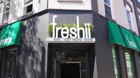 Freshii grass sign on the building
