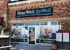 Hear well Be well sign on the building
