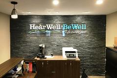Hear well Be well sign inside the building