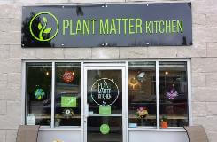 Plant matter kitchen signage on the store building
