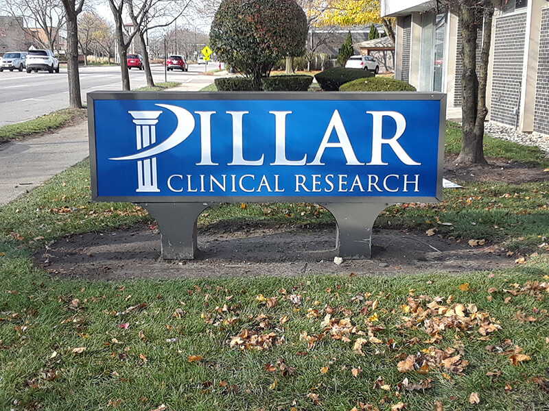 Pillar Clinical research monument signage outside the clinic