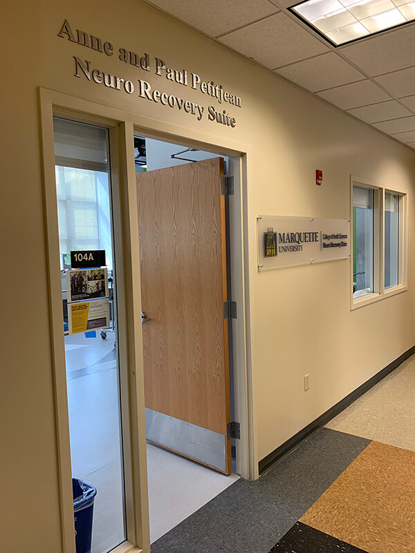Custom decal on the wall of a room with lettering above the door
