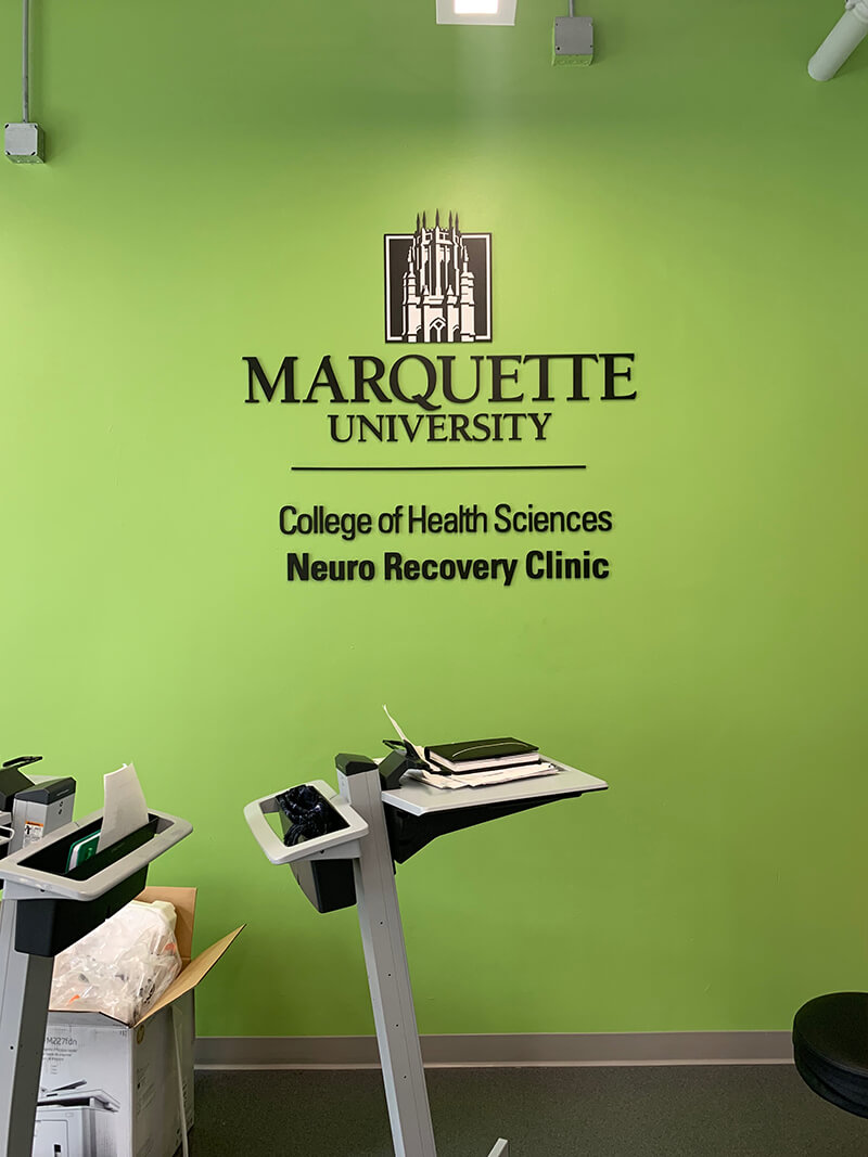 Marquette University signage on the color green wall