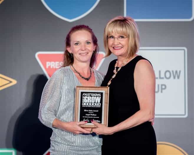 Angel Wallace and Catherine Monson with the Silver Sales Award