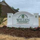 Dimensional letter monument signage in front of a house