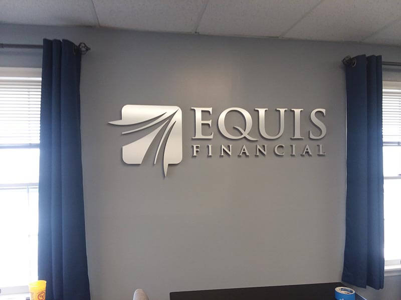 Equis Financial custom decal on the wall of the office 