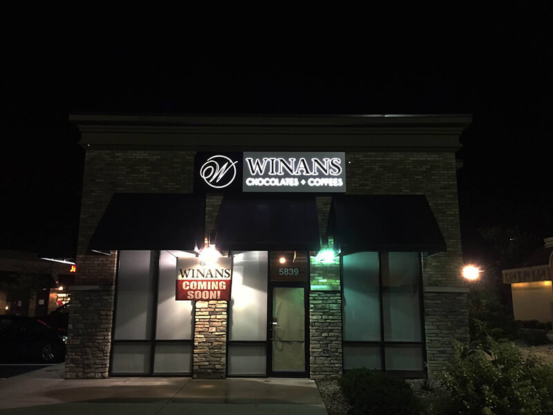 Winans Custom signage on a close store