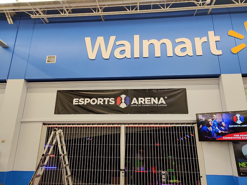 large black banner hung inside a Walmart store