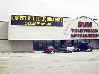 a large banner indicates a new store opening