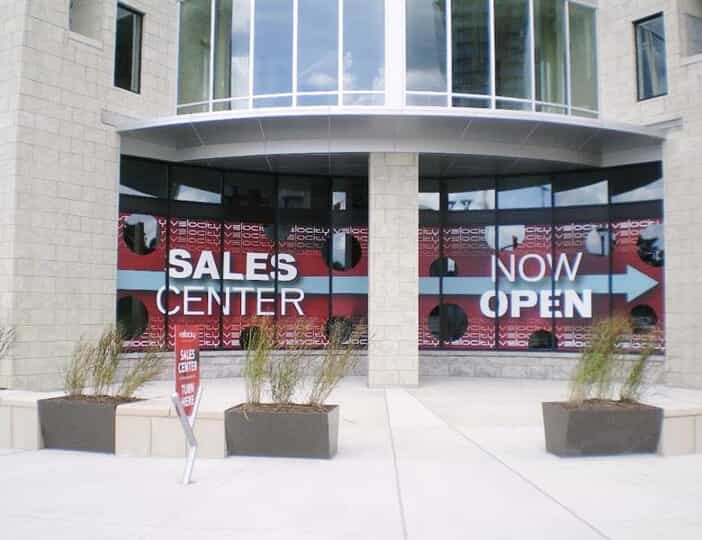 Large now open signs in a brick and mortar store