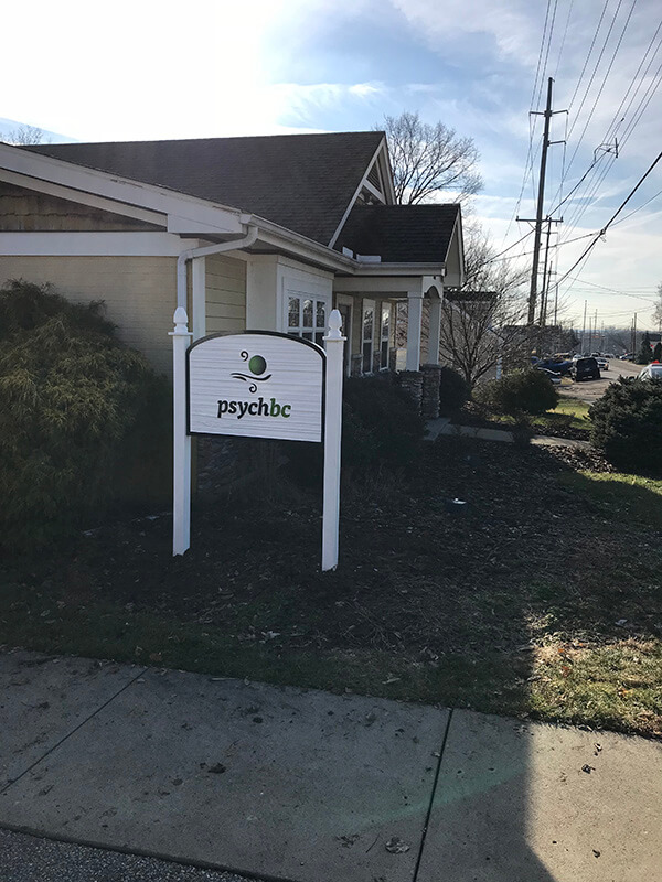 White signage with psychbc logo outside the house