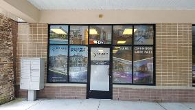 Alberly advertisement on the front door of the building