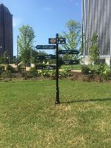 Sister cities direction post in a middle of an empty space lot