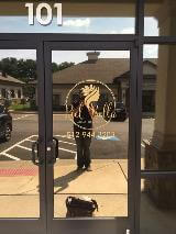 Riel Bella logo on the door of the building