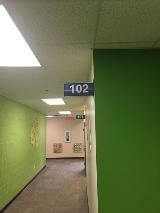 102 sign along the hallway