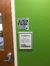 room 102 sign on the wall