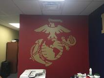 Eagle and word image on the wall with reception desk