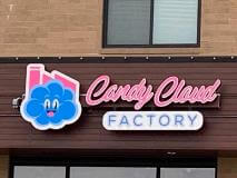 Pink and blue candy Cloud channel sign on the building