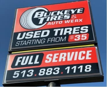 Buckeye Tires signage in the sunny weather with color black and red as  background