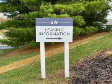 BW Leasing information signage in front of a big tree