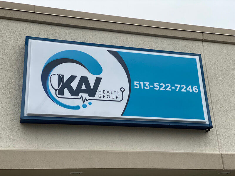 KAV Health Group signage on the building with blue and white theme