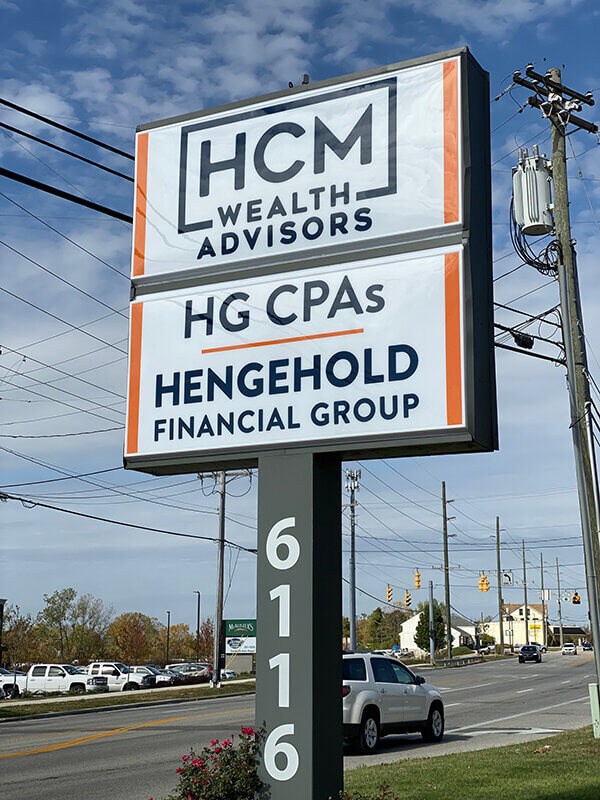 HCM Wealth Advisors wayfinding signs by the side of the road