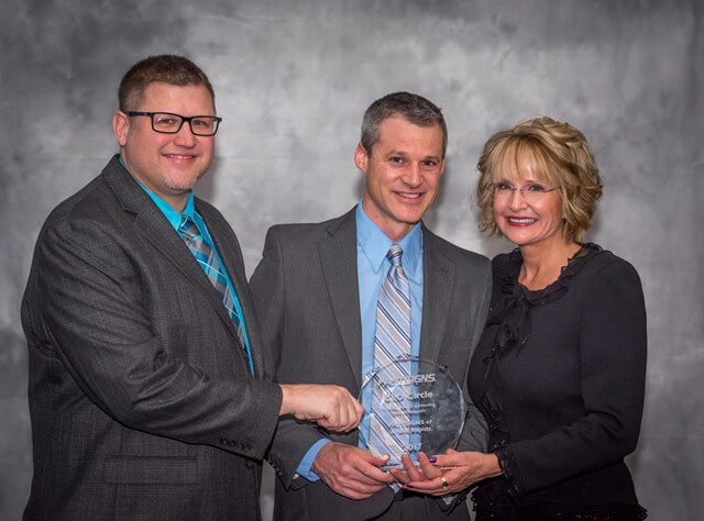 Mike Gilpin and Tim Sinen receive the CEO Circle Award presented by Catherine Monson