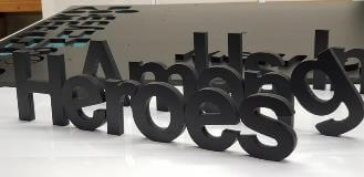 Heroes custom sign on the floor