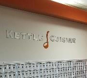 Kettle cuisine decal on the wall with lockers below