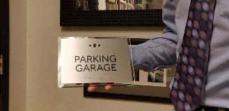 Parking garage custom decal holding by a man