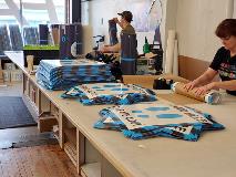 Employee working on the custom decal items