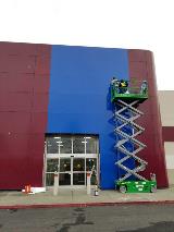 Blue and purple building with working employee