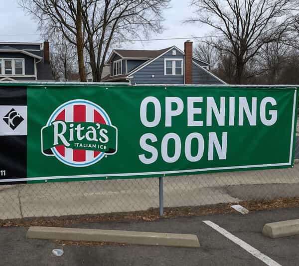 An image of an outdoor Opening Soon sign for Rita's Italian Ice.