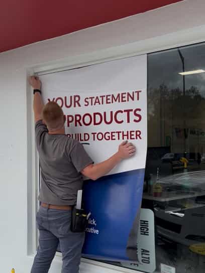 An image of an expert installing a sign.