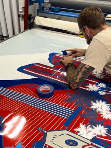 An image of a local signage expert working on a sign.