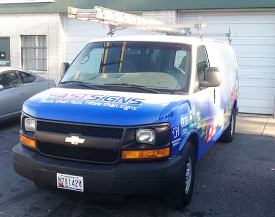 a van with fastsigns graphics