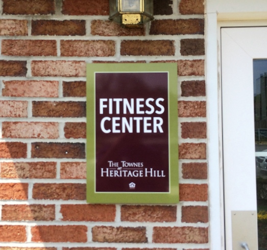 a sign indicates a fitness center