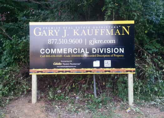 Gary Kaufman uses a road sign