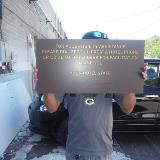 Tactile plaque holding by a man