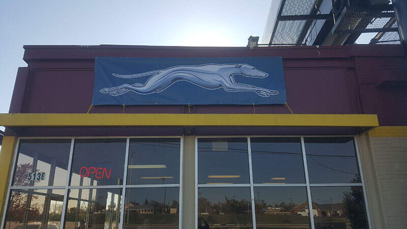 Building with a dog image banner 