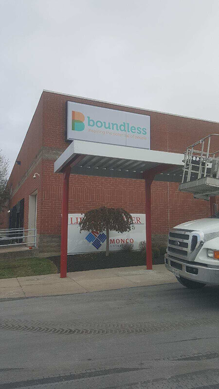 Boundless sign on the building wind waiting shed and car on the front