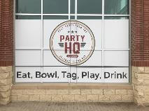 Store window with lettering  of party HQ