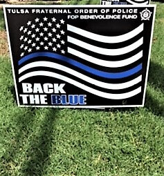 Back the Blue lawn sign with black, white and blue American flag
