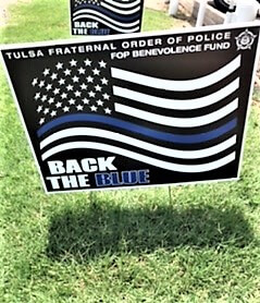 Back the Blue lawn sign with black, white and blue American flag