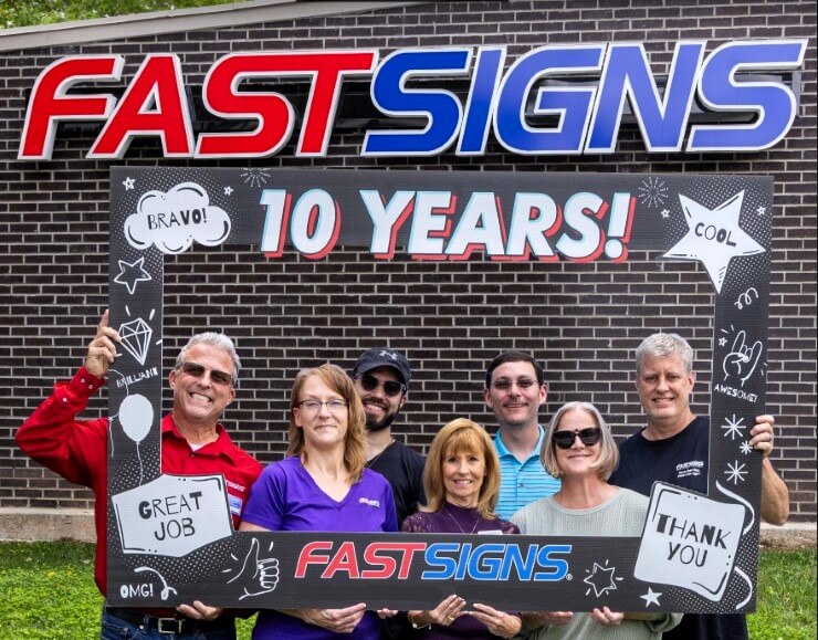 The team of FASTSIGNS Snellville poses together