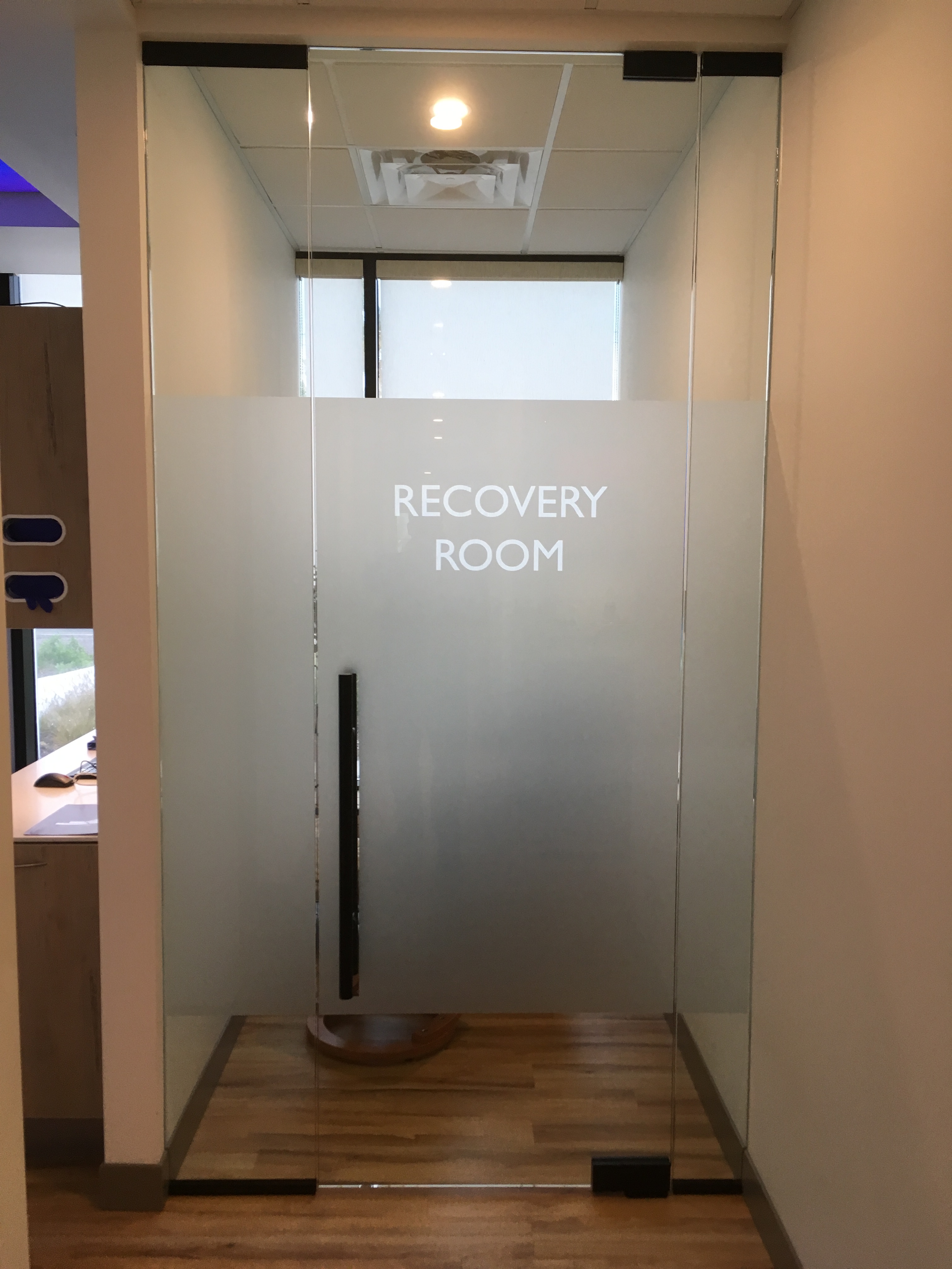 frost privacy glass with recovery room printed on