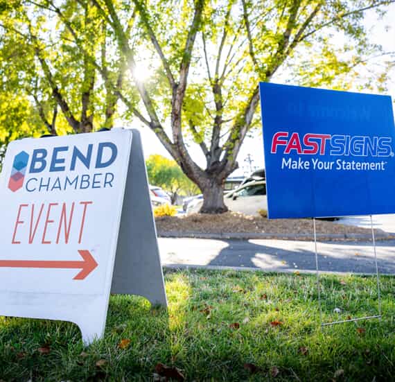 An image of FASTSIGNs' Bend Chamber Event yard signs and A-frame signs