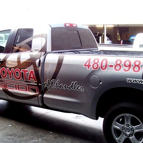 Gray pickup truck with custom vehicle graphics